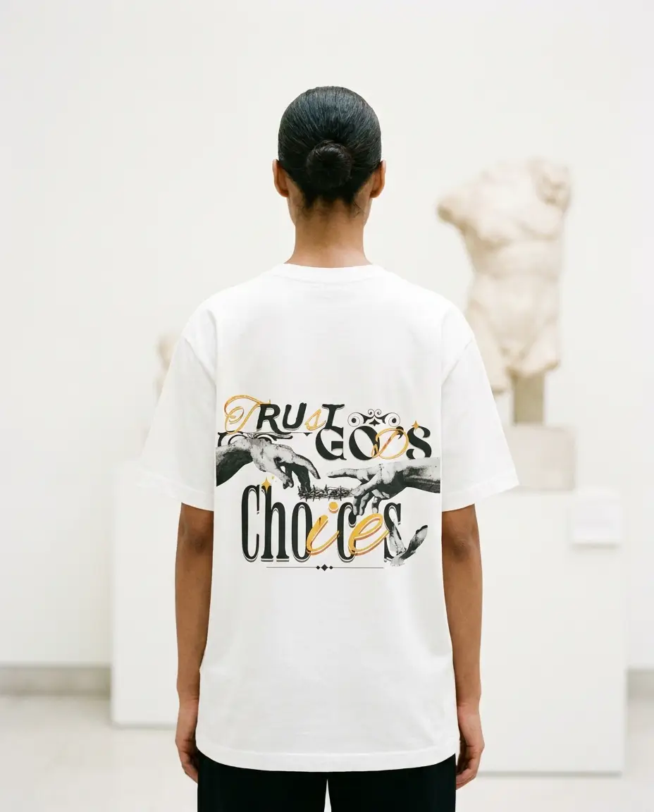 Creation tee on model, back to camera in a bright gallery beside a classical sculpture, Creation of Adam back print